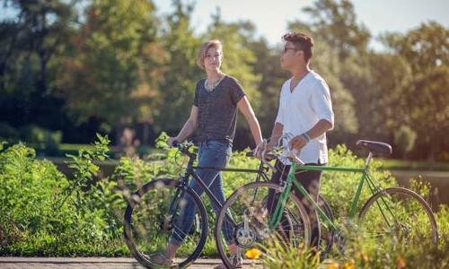 students outside with their bicycles 